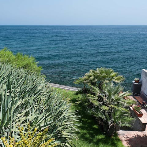 Stroll down to the pebbly beach from the home's terrace and swim in the Ionian Sea