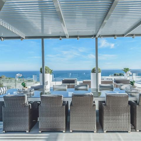 Dine alfresco under the pergola on the rooftop terrace