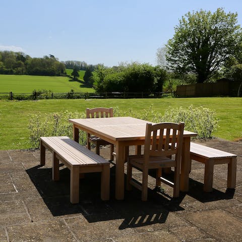 Sip tea out in the garden, overlooking the South Downs National Park