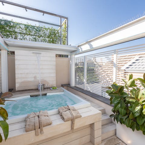 Relax and unwind with a long soak in the rooftop Jacuzzi 