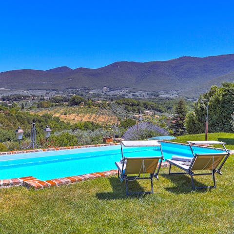Lounge by the pool while enjoying views of Umbria's beautiful countryside