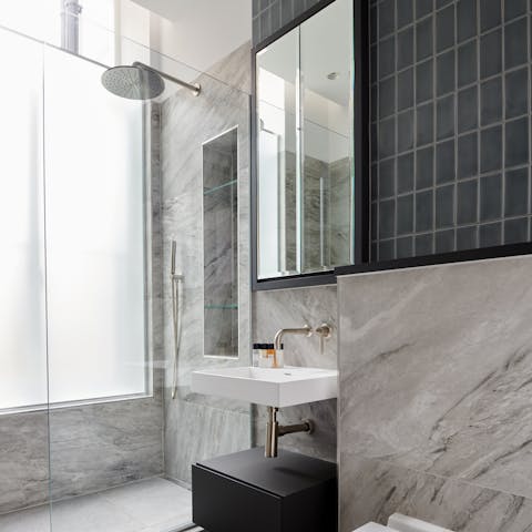 Relax with a soak in the rainfall shower after a day of sightseeing