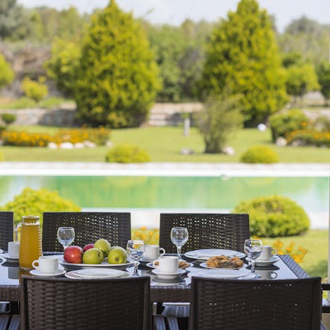 Take your meals overlooking the garden and pool