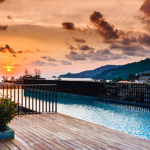 Head to the rooftop pool for early evening cocktails and the best view of sunset on the island