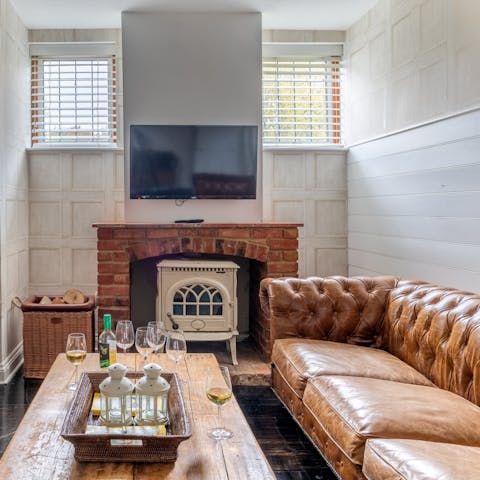 Unwind with a glass of wine in front of the cosy fire