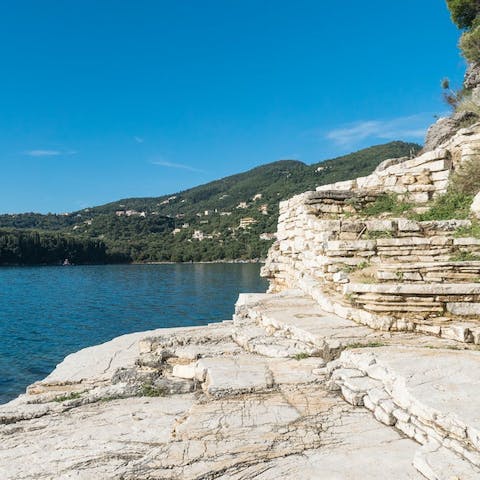 Pad down the rocky staircase straight from the villa to the sea