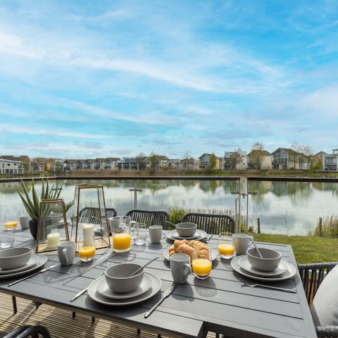 Set the dining table for long, lazy brunches on the lakeside terrace