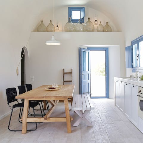 Nibble olives in your Cycladic-style kitchen before heading out to dinner