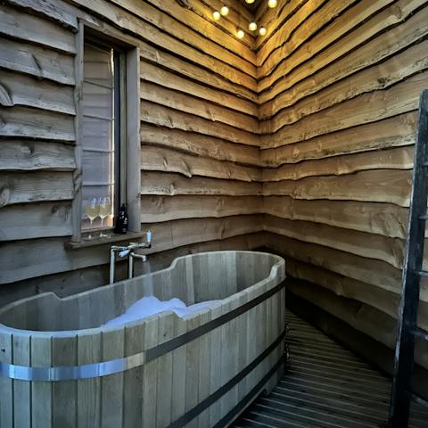Sink into a hot bath out on the terrace as the sun sets