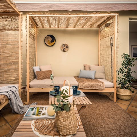 Relax on the daybed on your terrace after a busy day exploring Madrid