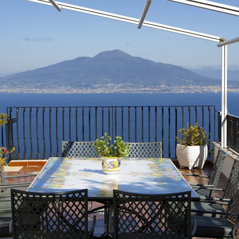 Dine alfresco with a view of Vesuvius