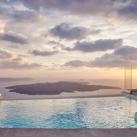 Swim to the edge of the infinity pool to overlook the ocean and a volcano
