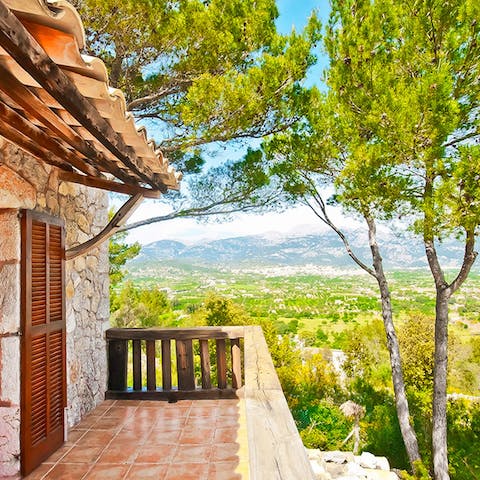 Admire mountain views over a glass of wine from the balcony