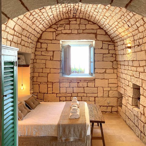 Wake up refreshed in your vaulted bedroom with stunning exposed stone