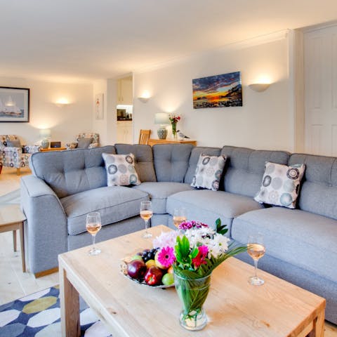 Sprawl out on the L-shaped sofa and rest your feet after a coastal walk