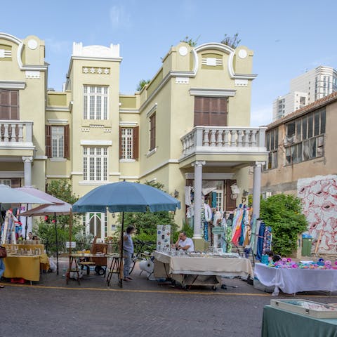 Explore the Nahalat Binyamin markets and pick up a painted memento of your stay