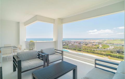 Watch the sun set into the sea from your private balcony