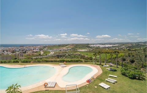 Hang out by the communal swimming pools on a scorching afternoon