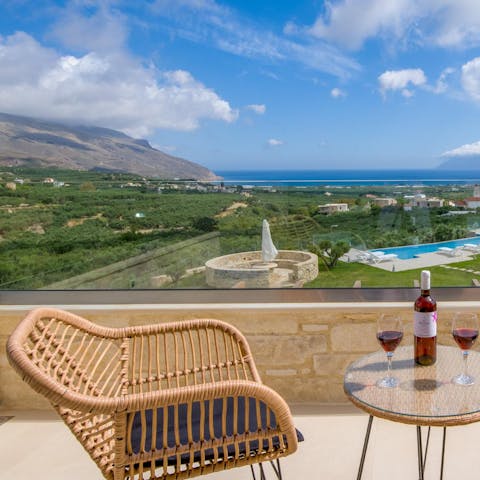 Sit out on the home's balcony and drink in the sweeping views of Crete