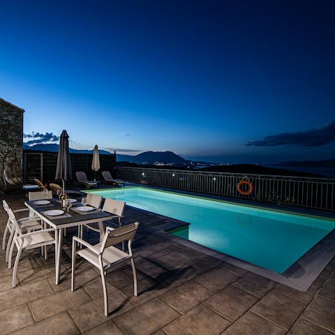 Dive into your pool at nighttime for a dip under the stars