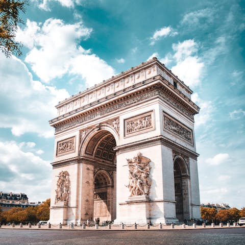 See the Arc de Triomphe in all it's majesty, around a twenty-minute walk away