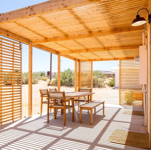 Set the table ready for shaded meals under the pergola