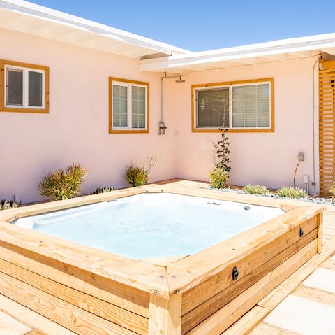 Gaze at the desert skies from the bubbles of your private hot tub