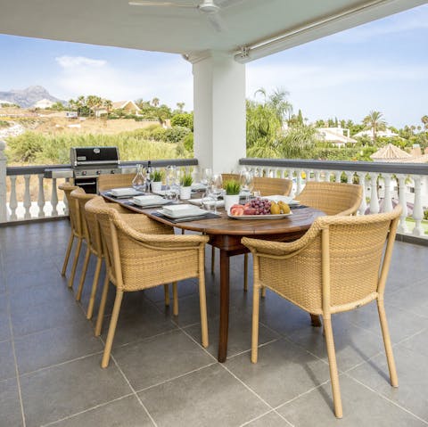 Gaze out over Spanish mountains and countryside from the alfresco dining table