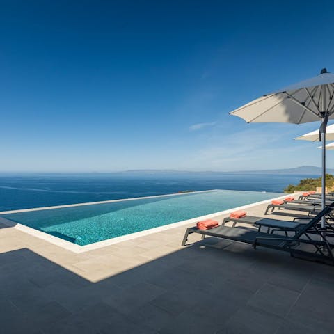Glide through your infinity pool with views over the Mediterranean