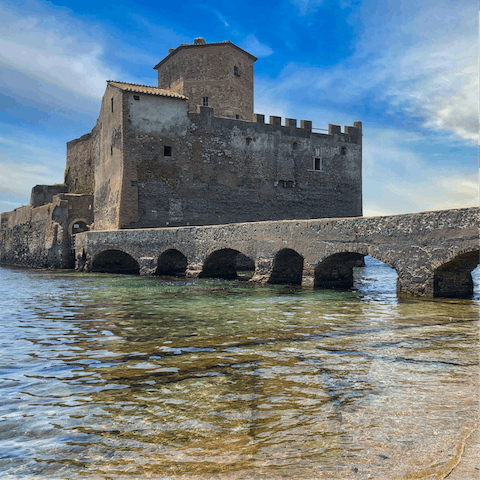 Jump in the car and visit the Torre Astura on the coast of Latium