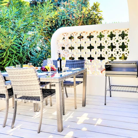 Tend to the barbecue as your loved ones set the table ready for an alfresco feast