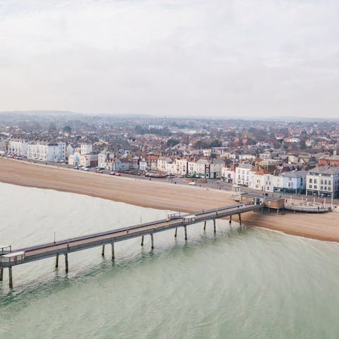 Wander down the coastline to reach Deal Pier in fifteen minutes