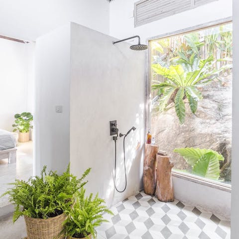 Freshen up in your rainfall shower as nature surrounds you from every angle