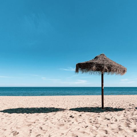 Spread out on Fuengirola's sandy beach, a five-minute stroll away
