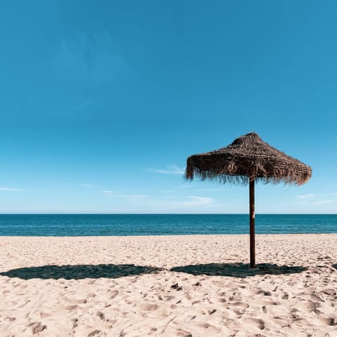 Spread out on Fuengirola's sandy beach, a five-minute stroll away