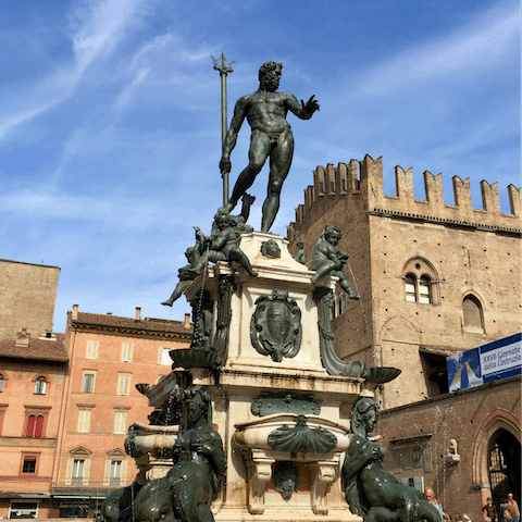 Stroll five minutes to the Piazza Maggiore and the Fountain of Neptune
