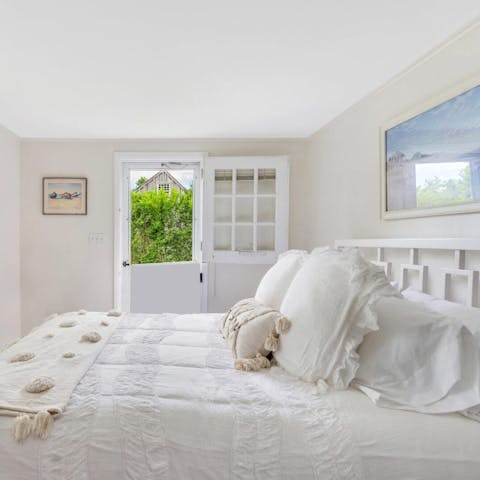 Enjoy access to the garden from the comfortable second bedroom