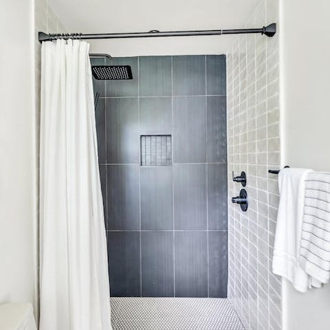 Start mornings with a luxurious soak under the rainfall shower