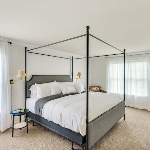 Wake up in the main bedroom's grand four-poster bed feeling rested and ready for another day of adventure
