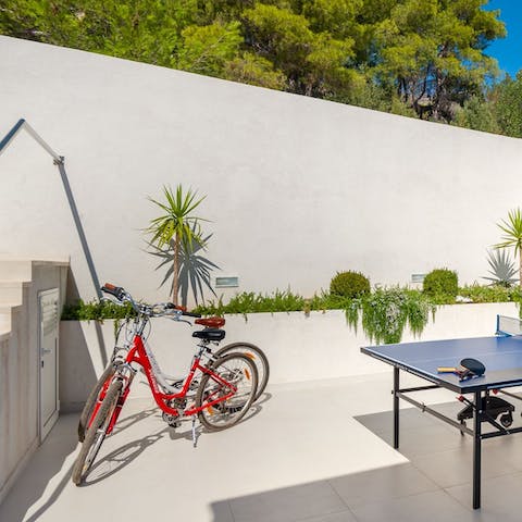 Hop on a bicycle to explore the island or play table tennis on days at home
