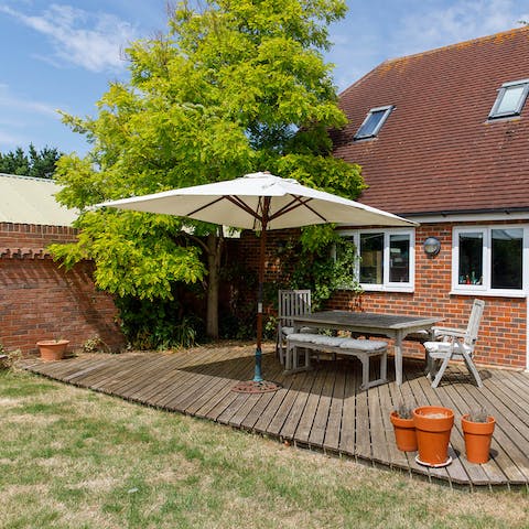 Dine alfresco in the summer months, grilling on the charcoal barbecue