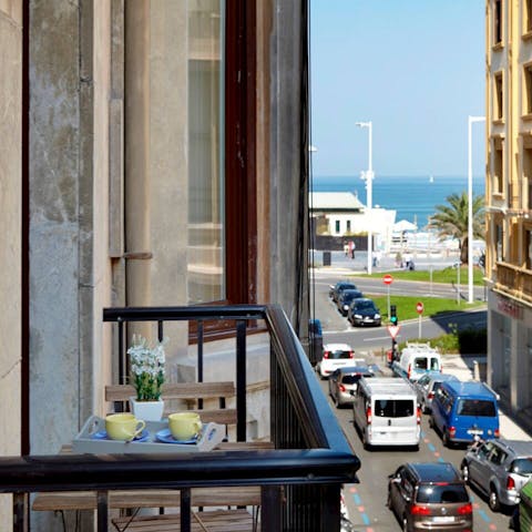 Catch a glimpse of the sea from the balcony