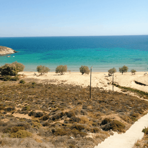 Build sandcastles at Livadi beach, only a ten–minute walk away