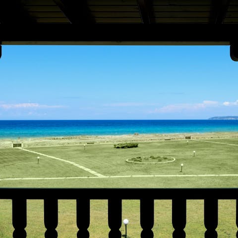 Look out over the azure sea from the balcony 