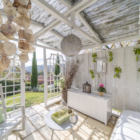 Pour yourself a glass of vino and relax in the charming summer house
