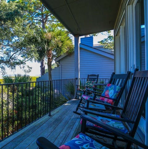 Listen to the diverse wildlife from the Southern-style rocking chairs on the deck