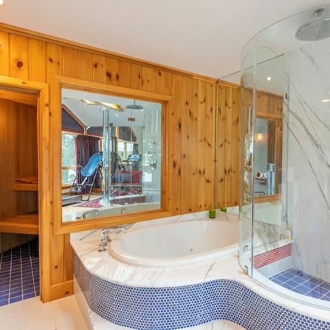 Enjoy a spa day with the master suite's private sauna and jacuzzi