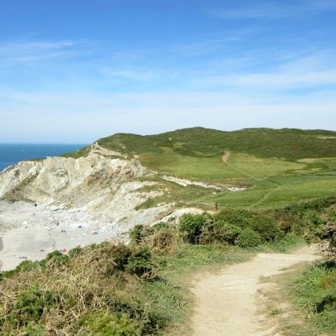 Explore scenic coastal paths – there's an entrance to one at the bottom of the road