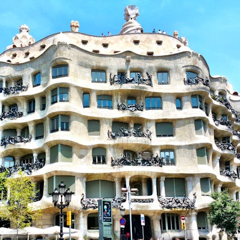 Stroll towards Passeig de Gràcia to admire Casa Milà