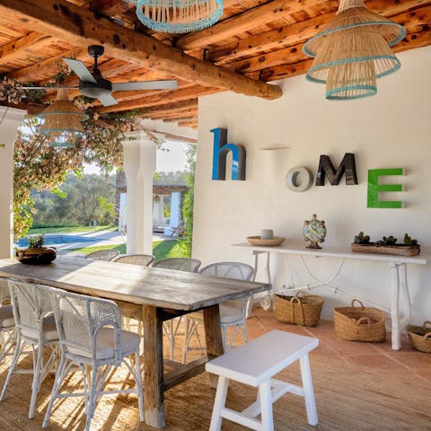 Savour al fresco meals around the wooden dining table